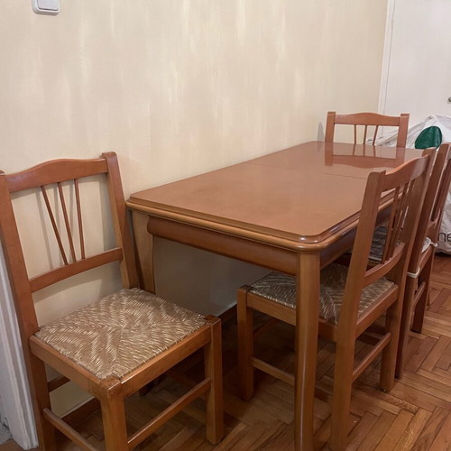 Wooden dining set used with 4 chairs and wicker seats