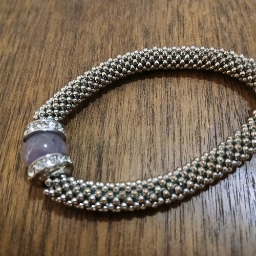 Women's bracelet with purple stone and white gems like new