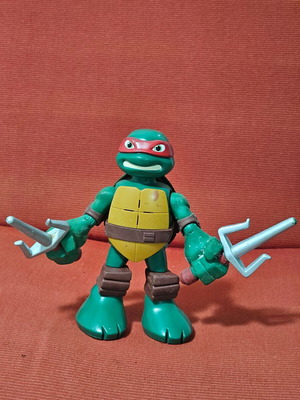 Raphael Teenage Mutant Ninja Turtle figure used with moving arms