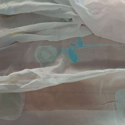 Semi-transparent curtain with soft floral patterns