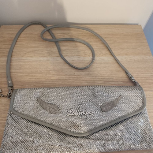 Lollipops bag silver color with decorative wings, like new