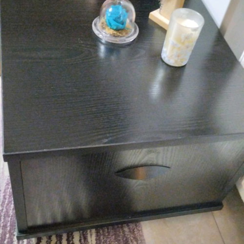 Side table used with storage and wheels, black wood effect