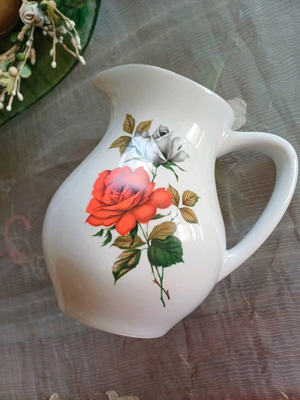 Vintage porcelain jug with romantic rose motif and gold details