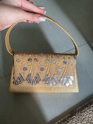 Vintage gold handbag used with crossbody strap