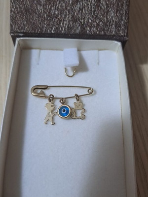 Gold K9 baby safety pin with boy and teddy charms