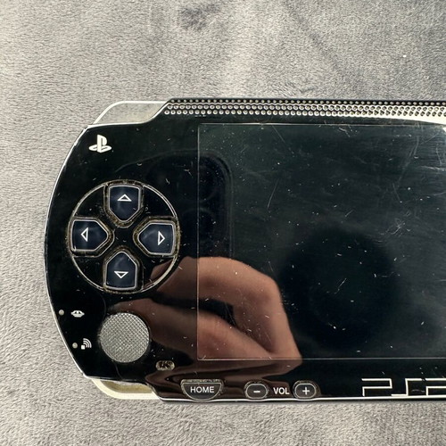 PlayStation Portable PSP-1000 used with charger, 5 games, and Memory Stick