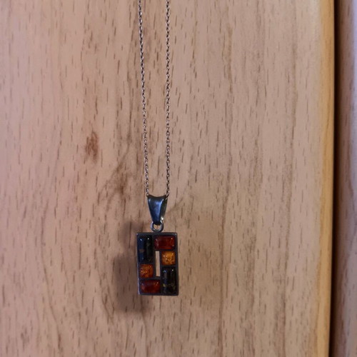 Silver pendant with Baltic amber like new