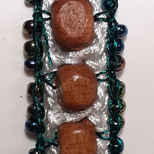 Handmade bracelet with brown wooden and green glass beads