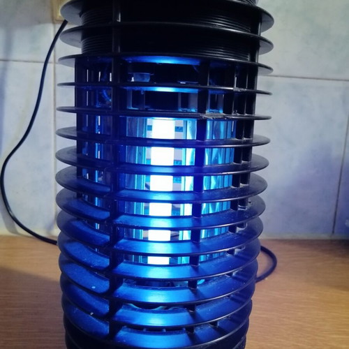 Electric insect trap used, black color, fully functional