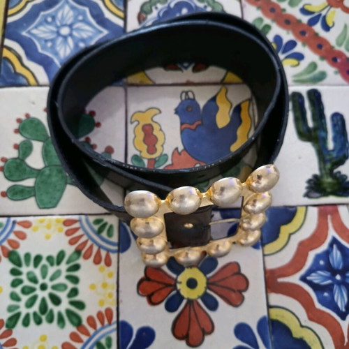 Belt used from faux leather with impressive brown buckle