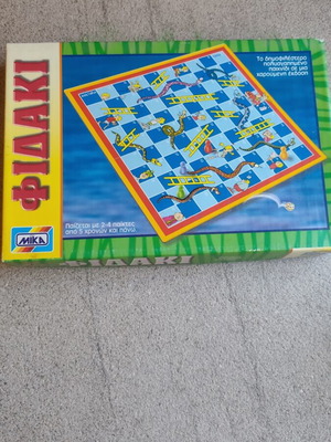 Snakes board game by Mika used