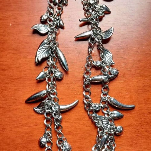 Silver Charm Necklace like new, long with leaf and drop pendants