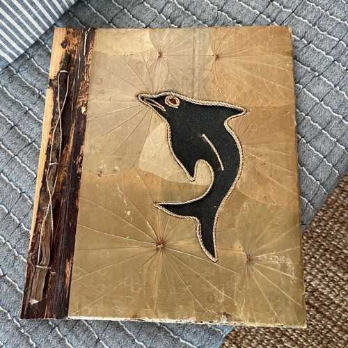 Photo album used with recycled paper, wood and natural leaf