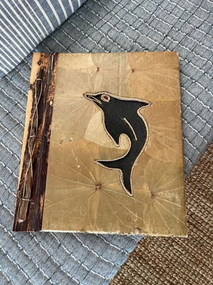 Photo album used with recycled paper, wood and natural leaf