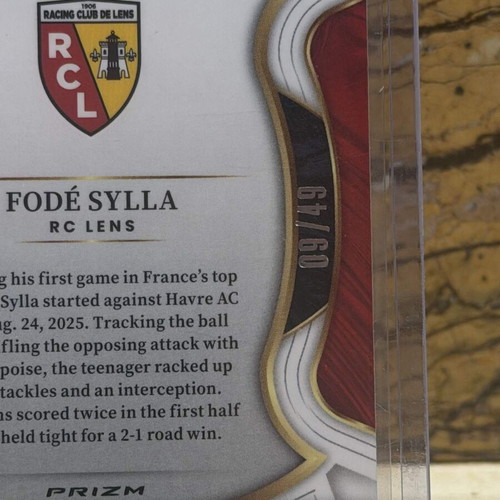 2025-26 Panini Select Ligue 1 Soccer Fode Sylla RC Terrace Purple Dragon Scale Prizm /49