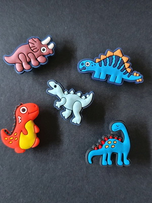 Crocs charms set with dinosaurs like new, blue