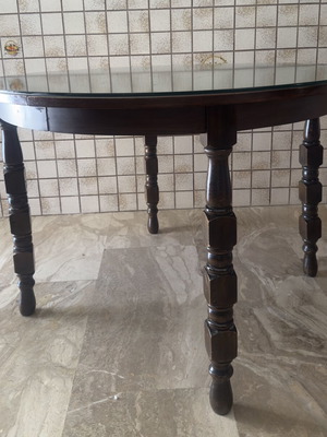 Wooden dining table used with round glass top