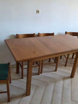 Vintage extendable dining table with 5 chairs used, one needs repair