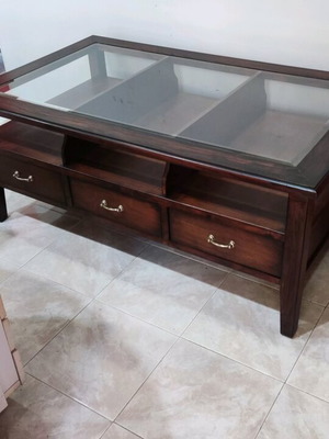 Solid wood coffee table like new with 3 drawers and glass top