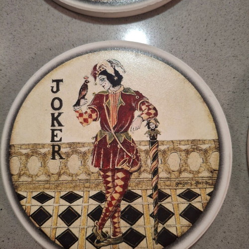 Set of 4 collectible ceramic coasters like new, 10cm diameter