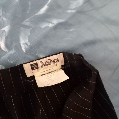 Elegant black suit with thin yellow stripes size 42 used by Lola