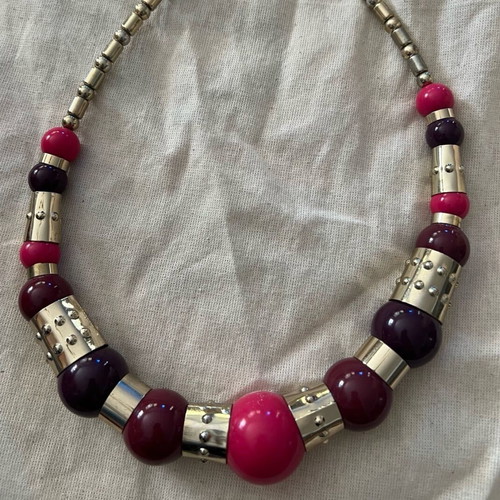 Statement necklace with large beads used, purple and gold details