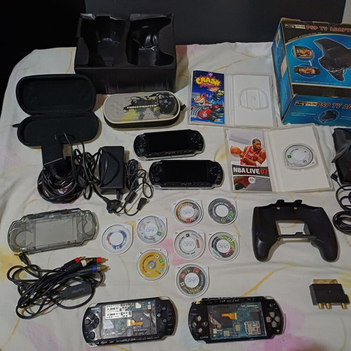 Sony PSP handheld consoles with accessories and games