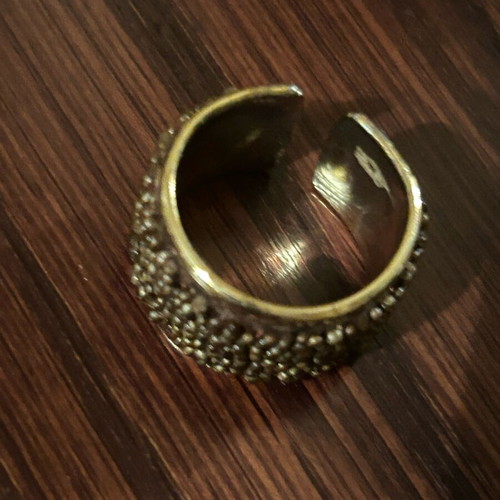 Steel ring gold plated with embossed brown designs like new, adjustable