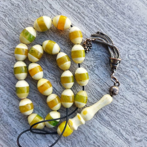 Komboloi made of camel bone with resin inlays used