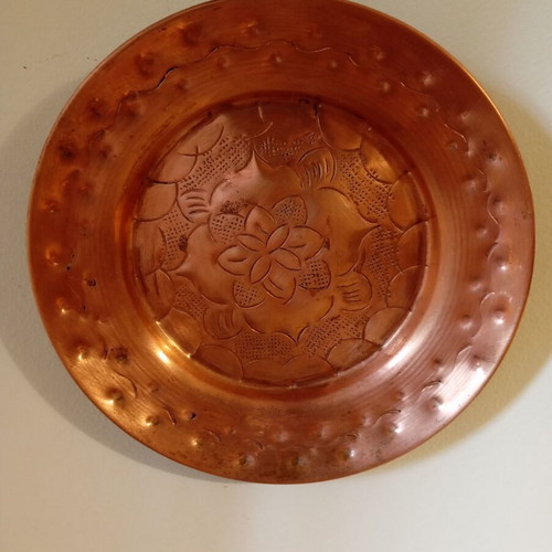 Vintage carved copper wall plate like new with embossed floral design