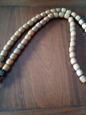 Giant worry beads used, wooden with metal bead