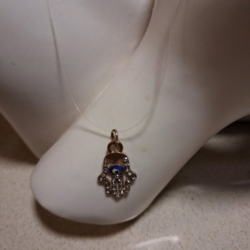Hamsa pendant with transparent synthetic fishing line used