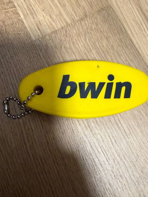 Authentic bwin keychain in bright yellow color new