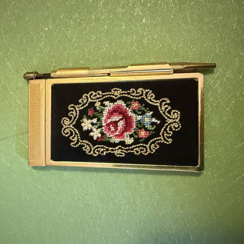 Vintage metal pocket notebook used with mechanical pencil and embroidery
