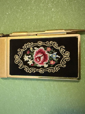 Vintage metal pocket notebook used with mechanical pencil and embroidery