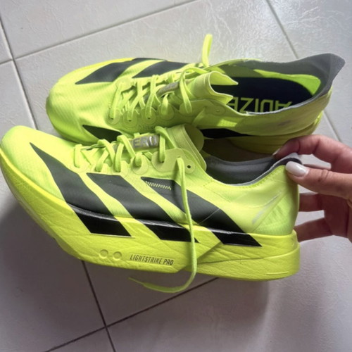 Adidas Adizero Adios Pro 4 running shoes, fluorescent yellow and black