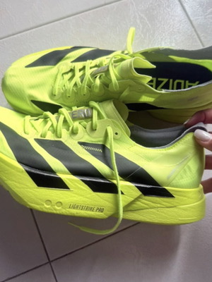 Adidas Adizero Adios Pro 4 running shoes, fluorescent yellow and black