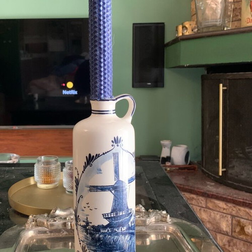 Delft bottle with hand-painted design and candle like new