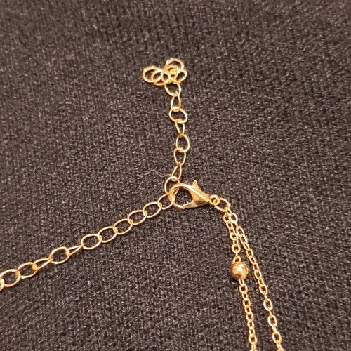 Double necklace in gold color like new with stars and crescent moons