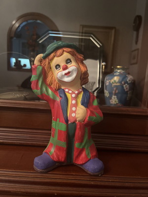 Vintage clown collectible used with colorful coat and hat