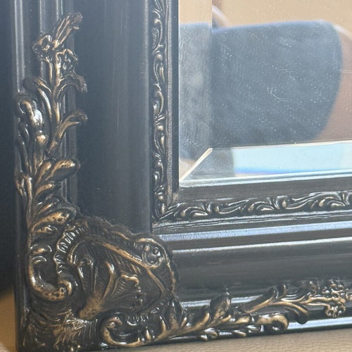 Woodcarved mirror with brass details used