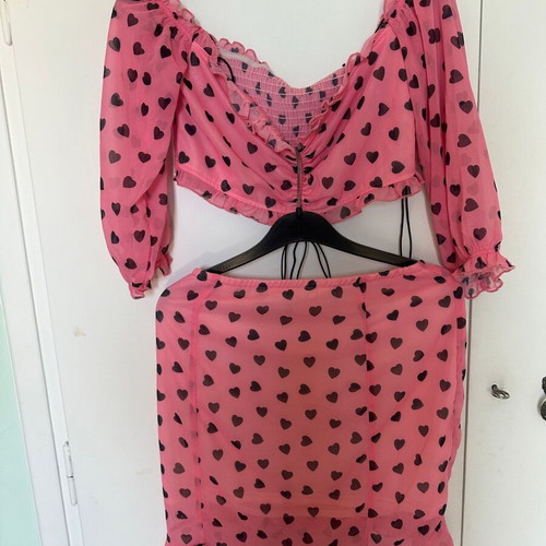 Top and skirt set pink with black hearts, like new, size small