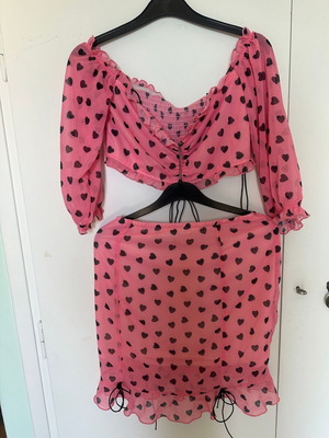 Top and skirt set pink with black hearts, like new, size small