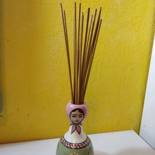Ceramic vase used with folk costume for aromatic sticks