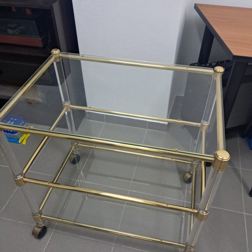 Glass coffee table with wheels, gold color