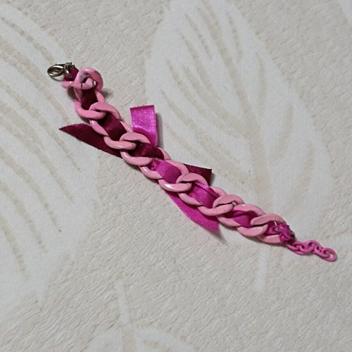 Pink bracelet with chain and bow, new