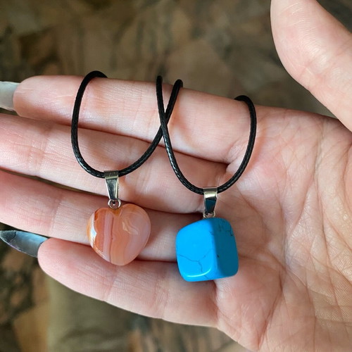 Pack of two crystal necklaces new with black cord unisex