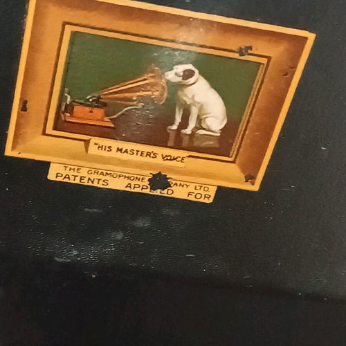 His Master's Voice portable gramophone used with accessories