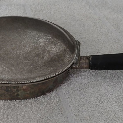 Antique heating vessel used for bed