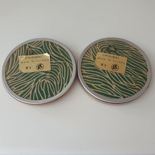 Two round butterfly wall clocks with domed glass
